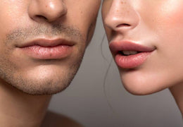 Close shot of woman and man's face, showing their nose and lips.