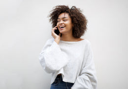Woman smiling and talking on the phone