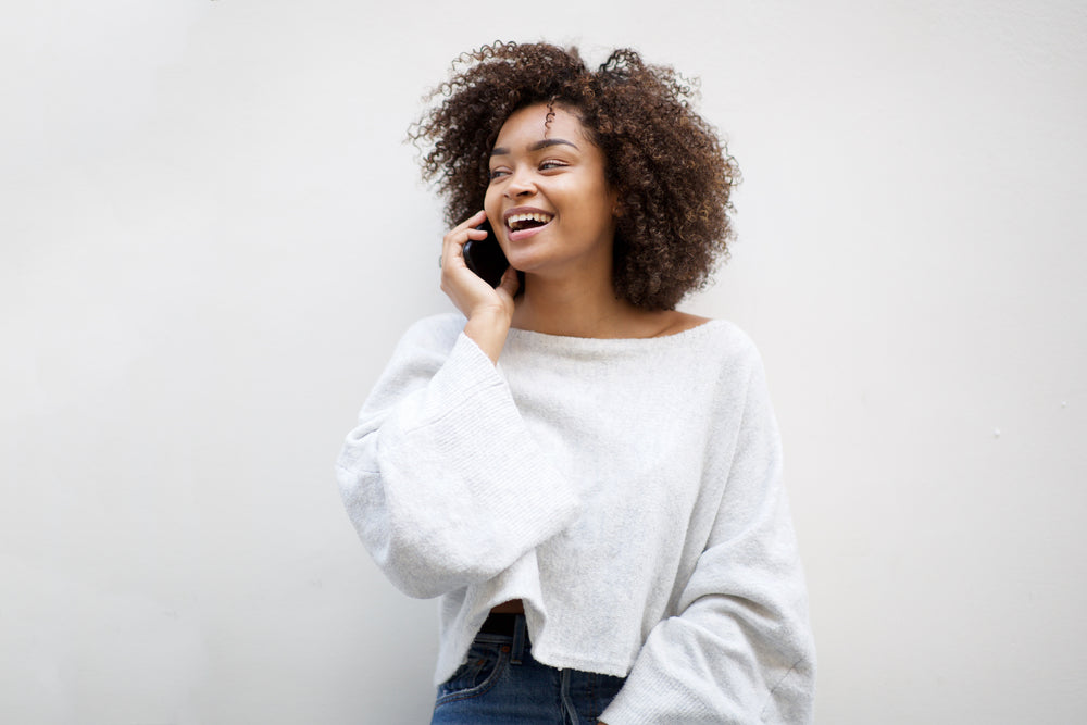 Woman smiling and talking on the phone