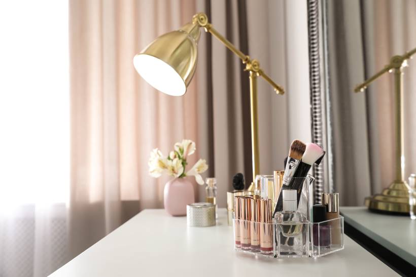 Makeup organized on white table