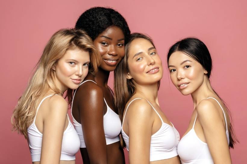 Group of women smiling next to each other